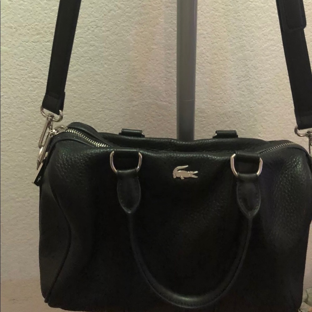 A preowned in perfect condition Lacoste bag